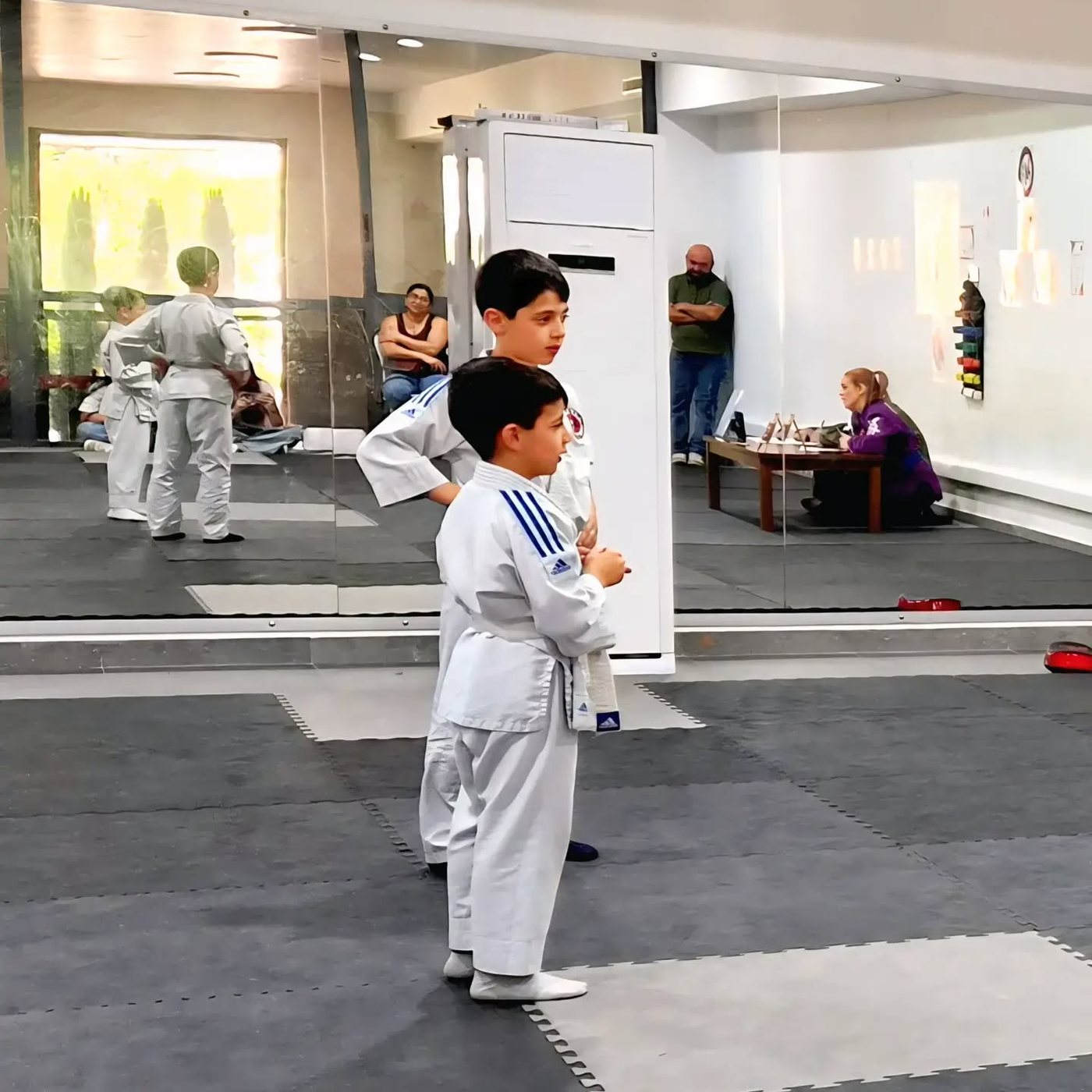 The Bikfaya training room, mats laid out with a class in progress